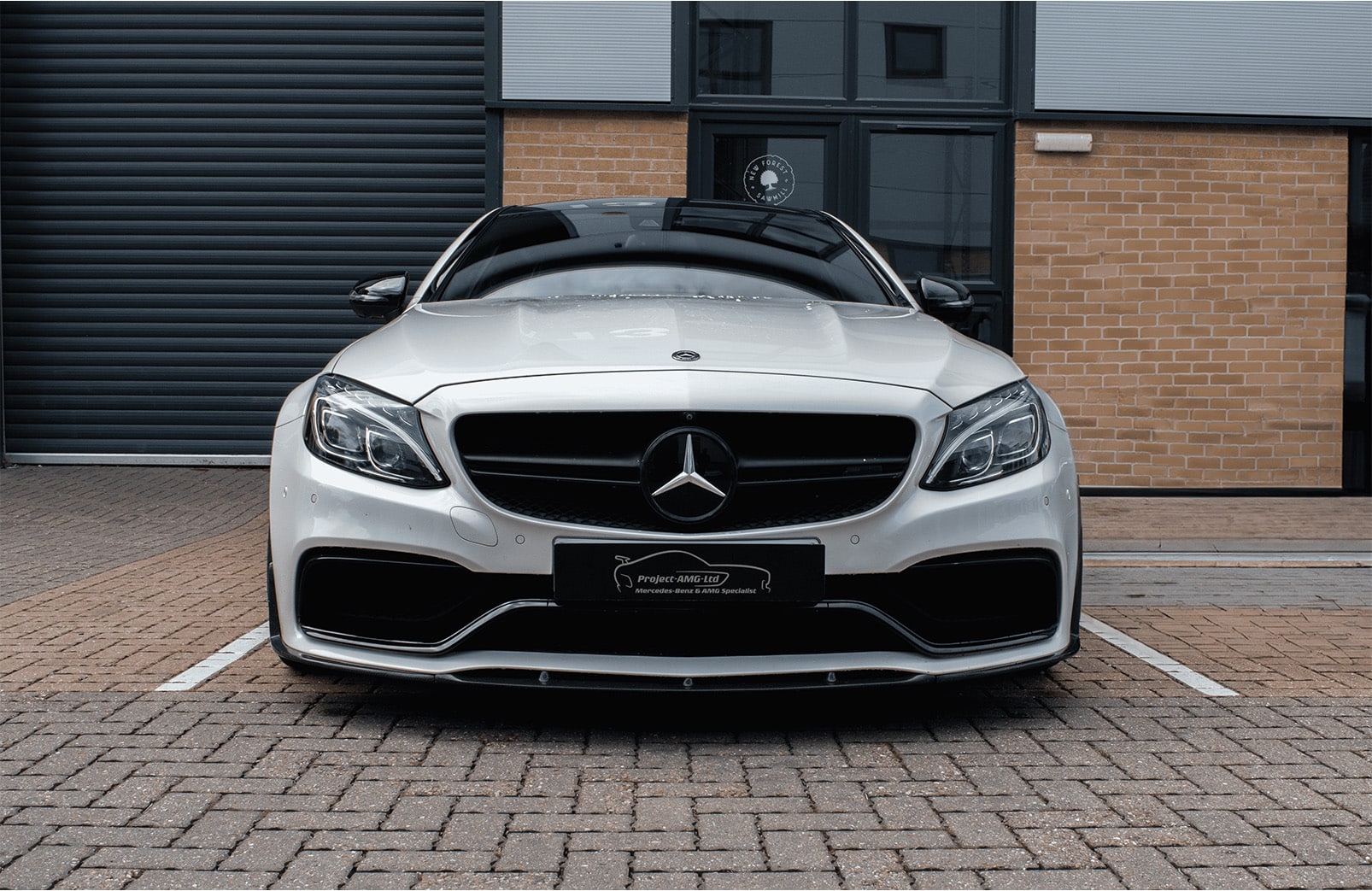 White mercedes front on