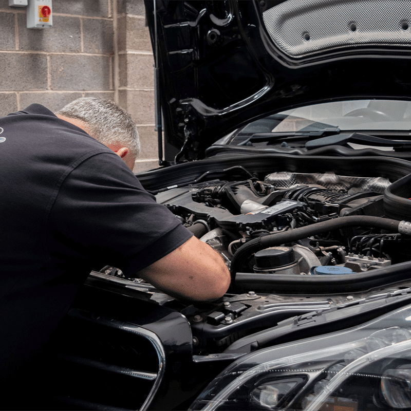 employee working in the engine bay