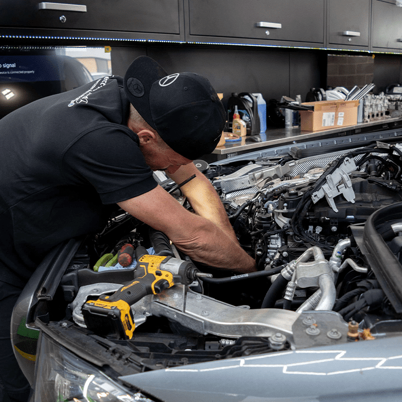 employee working in the engine bay